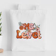 Load image into Gallery viewer, personalized teacher tote bag with the teacher's name in floral design