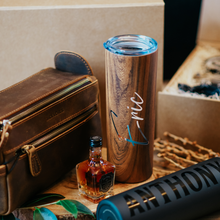 Load image into Gallery viewer, 20 oz personalized stainless steel skinny tumblers for men, with lid and custom name. Perfect groomsmen cups for the wedding day. Image displays a groomsman proposal box with its collection of gift items.