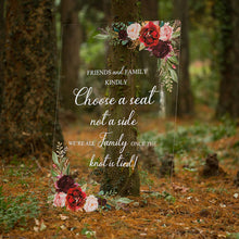 Load image into Gallery viewer, A charming wedding sign with a rustic wood background and handwritten-style text reads &quot;Friends and family, kindly choose a seat, not a side. We&#39;re all family once the knot is tied.&quot; The warm and inviting message is accented with playful and decorative elements, making it a perfect addition to any wedding ceremony.
