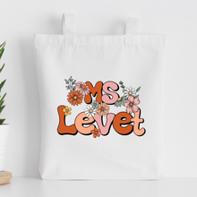 Load image into Gallery viewer, personalized teacher tote bag with the teacher&#39;s name in floral design

