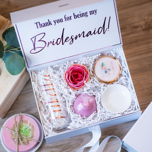 Bridesmaid proposal box with champagne flute, personalized compact mirror, and jewelry dish. A thoughtful way to ask special ladies to stand by the bride.