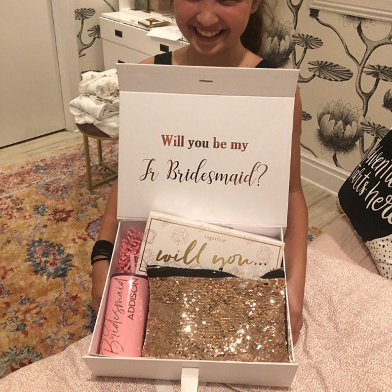 Our Junior Bridesmaid Proposal Keepsake Boxes are a thoughtful way to ask your young loved one to be a part of your big day. Crafted with high-quality materials, these personalized boxes are a unique way to ask 